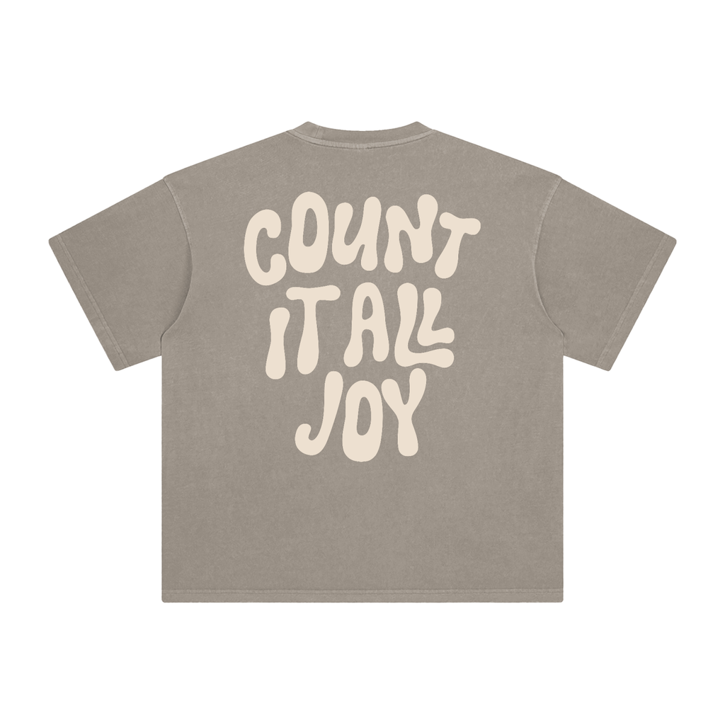 Beige t-shirt with 'COUNT IT ALL JOY' text on a white background