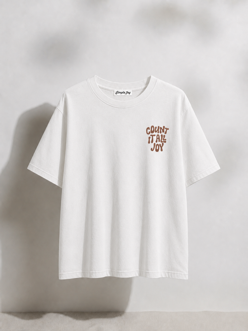 White t-shirt with text on a light gray background