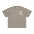 A taupe gray short-sleeve t-shirt with a cream-colored graphic text print reading 'COUNT IT ALL JOY' on the left chest, displayed flat against a solid white background.