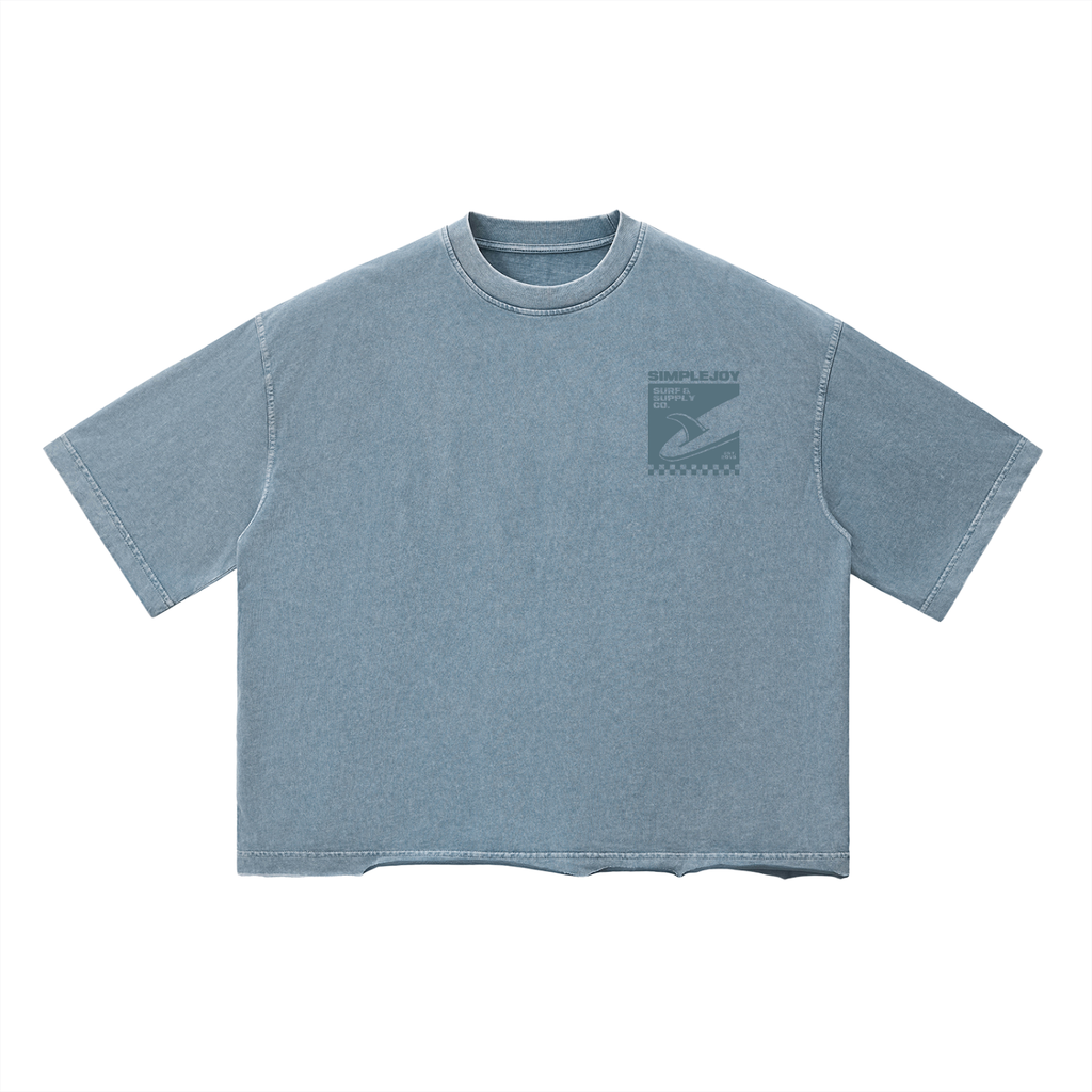 A washed light blue short-sleeve t-shirt with a dark gray graphic print on the left chest, displayed flat against a solid white background.